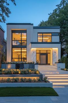 a modern house with stairs leading up to it