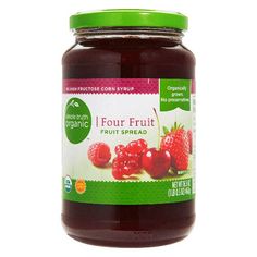 a jar of fruit spread with raspberries and cherries