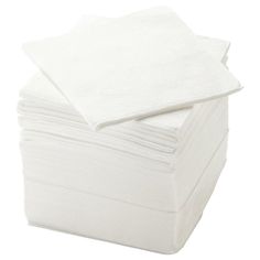 a stack of white napkins sitting on top of each other