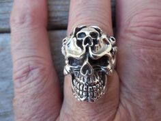 Skull ring....1 1/8" tall by 1" wide, cast and antiqued in sterling silver 925....skull ring with skull breaking thru the forehead, great looking very detailed ring...the ring is a size 10 and can be sized from size 8 to size 13, so when ordering just put the ring size needed in the notes....thanks, Bill Gothic Skull Ring Stamped 925, Sterling Silver Skull Ring With Engraving, Sterling Silver Skull Ring Engraved, Sterling Silver Engraved Skull Ring, Sterling Silver Skull Ring Collectible, Hand Cast Gothic Skull Ring In Sterling Silver, Gothic Sterling Silver Skull Ring With Oxidized Finish, Gothic Hand Cast Sterling Silver Skull Ring, Gothic Oxidized Sterling Silver Skull Ring