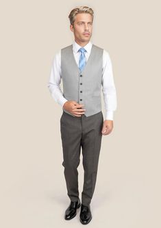 Complete your ensemble with our premium Glacier Grey Twill Vest. Cut from luxurious Super 110's 100% merino wool by Vitale Barberis Canonico, this custom-made vest adds the final touches to a sophisticated and classic style. Perfect for any occasion, its versatility will easily take you from day to night. Winter Semi-formal Slim Fit Vest, Elegant Winter Vest, Slim Fit Formal Vest For Winter, Winter Formal Slim Fit Vest, Elegant Fitted Winter Vest, Elegant Fitted Vest For Winter, Classic Slim Fit Winter Vest, Classic Fitted Winter Vest, Classic Fitted Vest For Winter