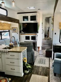 a kitchen and living room in a mobile home