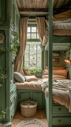 a bedroom with green painted walls and wooden flooring, built into the side of a building