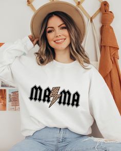 "Mama Lightning Bolt Sweatshirt, Leopard Mama Hoodie, ACDC Mama Sweater, 90's ACDC Leopard Sweatshirt, Mothers Day Gift Sweater Hi all, welcome to the Comfy Tee Design, It's so nice to see you here. If you are looking for soft, comfy and high quality sweatshirts, I have good news for you: You're at the right place!  Sweatshirts are unisex sizing. It's proper, comfortable and flattering for men and women, but may run  large for the ladies. Please see the size chart to find your perfect fit.  Cont White Oversized Band Merch Sweatshirt, Retro White Sweatshirt For Winter, White Retro Winter Sweatshirt, Retro White Winter Sweatshirt, Lettering Sweatshirt For Spring Streetwear, 90s Letter Print Hoodie For Fall, White Band Merch Sweatshirt For Fall, 90s Style Hoodie Sweatshirt With Graphic Print, 90s Style Graphic Print Hoodie Sweatshirt