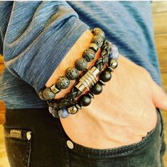 This set comes with three bracelets. One lava stone (stretch), one black braided leather bracelet with stainless steel magnetic closure, and one blue lapis with hematite accents (stretch).