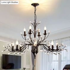 a chandelier hanging from the ceiling in a living room