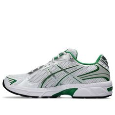 The ASICS GEL-1130 sneakers offer a classic retro sports style. Featuring a white mesh upper with silver and green accents, these shoes provide a comfortable fit with soft padding around the ankle. The GEL-tech cushioned midsole delivers essential comfort, while the durable rubber outsole ensures grippy traction.  Complete with iconic ASICS branding, these sneakers are a stylish and functional choice. Retro Sports, Limited Edition Sneakers, Sports Style, Green Accents, White Mesh, Asics Gel, Sport Sneakers, Sport Fashion, White Silver