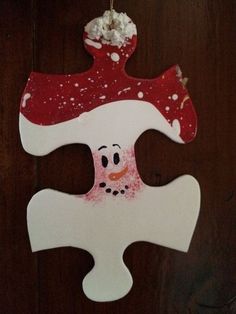 a christmas ornament hanging from a wooden door