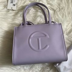 New And Never Used. Comes With Dust Bag. Lavender Color. Trendy Purple Bag With Dust Bag Included, Chic Purple Bag With Top Carry Handle, Chic Lavender Rectangular Shoulder Bag, Chic Purple Shopping Bag, Chic Purple Shoulder Bag For Shopping, Luxury Lavender Rectangular Bag, Chic Lavender Crossbody Shoulder Bag, Trendy Lavender Shopping Bag, Chic Lavender Bags For Daily Use