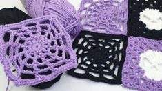 crocheted squares are arranged on a table