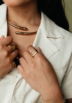 Inspired by a classic signet shape, the Open Square Statement Ring features a stunning, distinct open-center. This is the kind of style you can wear every day. Handcrafted in recycled brass by artisans in Kenya using traditional techniques. Handcrafted in recycled brass by artisans in Kenya. Gold products are 24k gold plated brass and match our brass style in color and tone. Your purchase promotes artisan innovation + entrepreneurship. To learn more about keeping your jewelry shining like new, see our Product Care Guide. This product runs small, it's recommended to size up. Top: 0.59in x 0.59in (15mm x 15mm) Innovation And Entrepreneurship, Gold Statement Ring, Statement Ring Silver, Pop Up Shop, Traditional Techniques, Chrome Plating, Egift Card, Statement Ring, Kenya