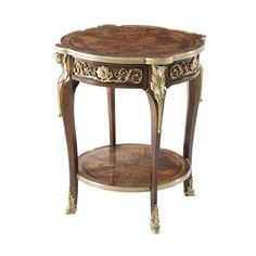 an ornately decorated side table with two shelves