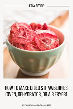 a bowl filled with strawberries on top of a wooden table