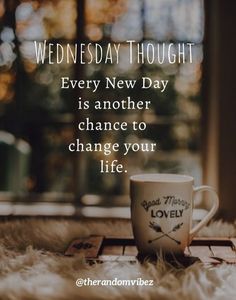 a coffee cup sitting on top of a fluffy white rug with the words wednesday thought every new day is another chance to change your life