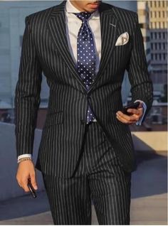 This pinstripe men's fashion casual suit jacket combines classic styling with modern convenience. It is made from a comfortable and breathable material, making it ideal for all-day wear. The classic pinstripes add subtle sophistication to any look. Whether for work or evening wear, this lightweight, wrinkle-resistant s Pinstripe Business Suits With Long Sleeves, Pinstripe Suits With Long Sleeves For Business, Pinstripe Long Sleeve Business Suits, Pinstripe Single Breasted Suit For Business Casual, Pinstripe Single-breasted Suit For Business Casual, Fitted Pinstripe Blazer For Business Casual, Spring Pinstripe Suits For Office, Spring Office Pinstripe Suits, Spring Pinstripe Office Suits