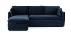 a blue couch with a footstool sitting next to it on a white background