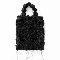 a handbag made out of black fabric