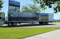 a large truck is parked on the side of the road