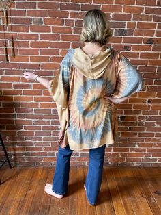 Stay cool and covered in Tie Dye with the Free Size Spiral Poncho Hoodie! Made of flowy rayon, this hoodie features armholes for a comfortable fit up to size 3X. Perfect for any boho festival or casual day out. Bust up to 55" around Arm circumference up to: 21" 30" long shoulder to hem 100% rayon hand wash gently, Air Dry Please take a moment to look over all shop policies before purchasing. Poncho Hoodie, Boho Festival, Stay Cool, Shop Policies, Air Dry, Free Size, That Look, Tie Dye, Comfort Fit