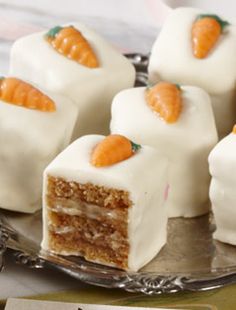 several pieces of cake sitting on top of a silver plate