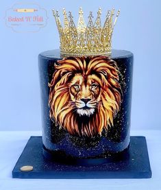 a cake decorated with a lion wearing a crown