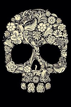 a skull with flowers and swirls on it