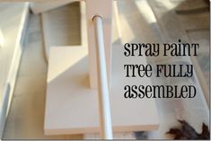 a sign that says spray paint tree fully assembled