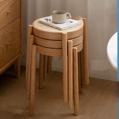 three wooden stools stacked on top of each other