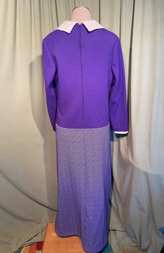 "This is a cute vintage dress from the 70s. Label reads, \"Bellfry by Gerald Pierce\". No size tag. The bust measures 40\", waist 38\", hip 36\", see measurements below. Made of a purple & white polyester with a seersucker type texture at the top texture, and a tweed weave on the skirt. The dress is not lined. It is long sleeve with a white accent at the neckline & sleeve cuffs, giving the illusion of a shirt underneath. It is a maxi dress with a seersucker style texture on the top & Fitted Long Sleeve Mod Dress, 1970s Fitted Purple Dress, Fitted 1970s Style Purple Dress, Retro Long Sleeve Fitted Dress, Retro Fitted Long Sleeve Dresses, Fitted Purple 1970s Style Dress, Fitted Long Sleeve Retro Dresses, Retro Long Sleeve Lined Vintage Dress, Fitted Long Sleeve Retro Vintage Dress