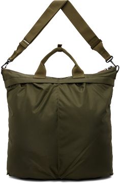 Lightweight nylon canvas tote in khaki. · Press-stud tab at webbing carry handles · Adjustable and detachable crossbody strap · Logo patch at face · Patch pockets and pleats · Zip closure · Zip pocket at interior · Fully lined · H16.5 x W18 x D2 Supplier color: Olive drab Military Style Nylon Bags For Everyday Use, Olive Travel Bag With Pockets, Khaki Satchel With Detachable Strap For Travel, Khaki Travel Satchel With Detachable Strap, Travel Satchel With Detachable Strap In Khaki, Military Style Travel Bag With Multiple Pockets, Khaki Nylon Shoulder Bag With Pockets, Khaki Nylon Bags With Zipper Closure, Khaki Nylon Bag With Zipper Closure