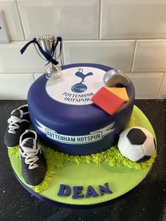 a cake made to look like a soccer ball and other items on top of it