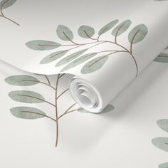 a white wallpaper with brown leaves on it