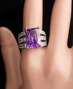 Not for the shy, this huge statement ring has a beautifully cut amethyst that is set with pave cz's on the side. 7-1 2017 Party Diamond Ring With Pave Setting, Dazzling Amethyst Ring For Anniversary, Formal Crystal Ring With Pave Setting, Amethyst Cubic Zirconia Ring For Anniversary, Dazzling Pave Set Crystal Ring As Gift, Party Rings With Accent Stones, Aquarius Girl, February Birthday, Spring Hill