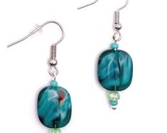 the earrings are made with glass beads