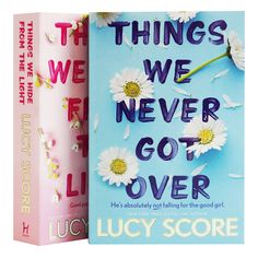 there are two books on the same book cover, one is pink and the other is blue