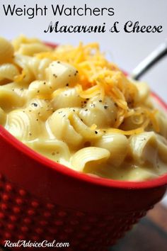 a red bowl filled with macaroni and cheese