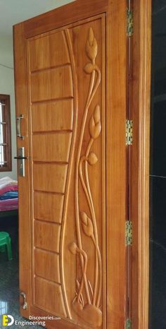 a wooden door with decorative carvings on it