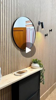 a bathroom with a sink and mirror on the wall