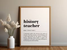 a white vase with flowers in it next to a poster on the wall that says history teacher