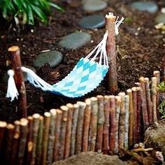 a miniature hammock is in the dirt