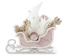 a pink sleigh with white feathers and pearls on the top is shown in front of a white background