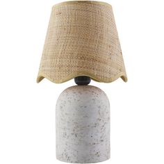 a white table lamp with a beige shade on it's base and a light bulb in the middle