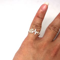 Silver Radiologic Technologist Heartbeat Ring is handmade with its own uniqueness. It can be bought as a gift for any occasion like birthday gift, wedding gift, travel gift, souvenir and etc. If you need rose gold plating or yellow gold plating, please contact us, we will advice you on the additional fees applicable. Base Material: Sterling Silver Size: 15mm X 9mm (Approximately) Ring Size: US 4 - US 14 (Please sellect your size) Metal Stamped: 925 Crafting Time: 7 - 10 working days Thickness: 1 Silver Adjustable Heart Ring For Gift, Adjustable Silver Heart Ring For Gift, Silver Adjustable Heart Ring As Gift, Symbolic Heart Ring For Valentine's Day Gift, Symbolic Adjustable Heart Ring As Gift, Unique Handmade Heart Ring For Gift, Unique Handmade Heart Ring As Gift, Unique Handmade Heart Ring Gift, Personalized White Heart Ring As A Gift