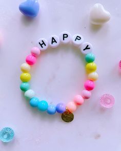 "This bracelet is handmade with love using large letter beads that spell out HAPPY and colorful beads all around.  **Please note the shipping time. This specific bracelet is a pre order, which means it will take anywhere between 1 - 3 weeks to arrive. To ensure a proper size, use a tape measure around your wrist. Place a dot where the tape measure meets. That is your wrist size! In our drop down menu, we have also included the average sizes for you. Please note we are not responsible if bracelet does not fit after providing this suggestion on how to measure a proper size. Suggestions for Circumference Sizes 6\" (Child) 6.5\" (Teen/Small Adult) 7\" (Average Adult) 7.5\" (Adult Large) If applicable: As with all plated metal items, these bracelets may fade away over time. To keep your bracele Fun Friendship Bracelets With Letter Beads As A Gift, Fun Friendship Bracelets With Letter Beads For Gifts, Trendy Beaded Bracelets With Letter Beads For Birthday, Colorful Everyday Friendship Bracelets With Letter Beads, Fun Letter Beads Friendship Bracelets As Gift, Fun Friendship Bracelets With Letter Beads, Fun Letter Bead Friendship Bracelets For Gifts, Fun Letter Beads Friendship Bracelets For Birthday, Playful Beaded Bracelets With Letter Beads For Birthday Gift