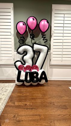 balloons are arranged in the shape of letters and numbers