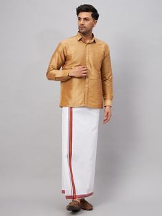 VM By VASTRAMAY Men's Rose Gold & White Silk Blend Shirt And Mundu Set A stylish fusion of tradition and modernity, this set exudes elegance and sophistication. Crafted from a luxurious silk blend, it offers comfort and style in equal measure. Features Black and white color combination Silk blend fabric for a luxurious feel Traditional mundu paired with a modern shirt Perfect for formal occasions Specifications Material: Silk blend Color: Black and white Size Options: S, M, L, XL Care: Dry clean Traditional Long Sleeve Semi-formal Sets, Festive Semi-formal Long Sleeve Shirt, Classic Long Sleeve Semi-formal Sets, Classic Long Sleeve Traditional Formal Wear, Traditional Festive Shirt For Formal Occasions, Classic Long Sleeve Traditional Wear For Eid, Festive Fitted Shirt For Semi-formal Occasions, Classic Traditional Wear With Traditional Drape For Formal Events, Traditional Gold Slub Silk Set