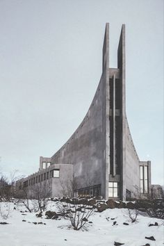 an unusual building is shown in the snow