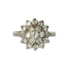 This cluster ring holds Diamonds totalling approx 1ct and are bright and sparkly. The stones are placed up high on an open work gallery, they are also set in platinum. Ring Size: L or 5 3/4 Cluster Diameter: 13mm Height From Finger: 8mm Weight: 4.5g Dazzling Platinum Cluster Ring, Platinum Cluster Ring In Diamond White With Round Cut, Dazzling Platinum Cluster Ring With Round Cut, Dazzling Diamond Cut Platinum Cluster Ring, Cluster Ring With Brilliant Cut For Promise, Cluster Diamond Ring With Halo Setting In Platinum, Silver Halo Ring With Brilliant Cluster Cut, Brilliant Cut Cluster Promise Ring, Silver Halo Ring With Brilliant Cut Cluster