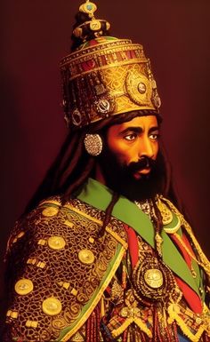 a man with long hair wearing a gold crown and green, red, and yellow outfit