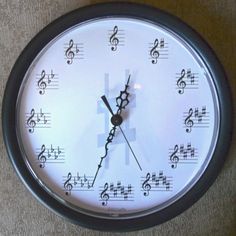 a clock with musical notes on the face